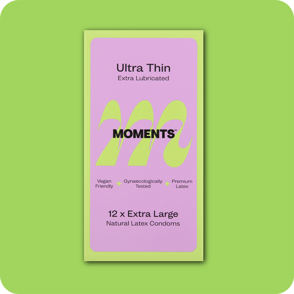 Moments Ultra Thin Extra Large condom box against a green backdrop