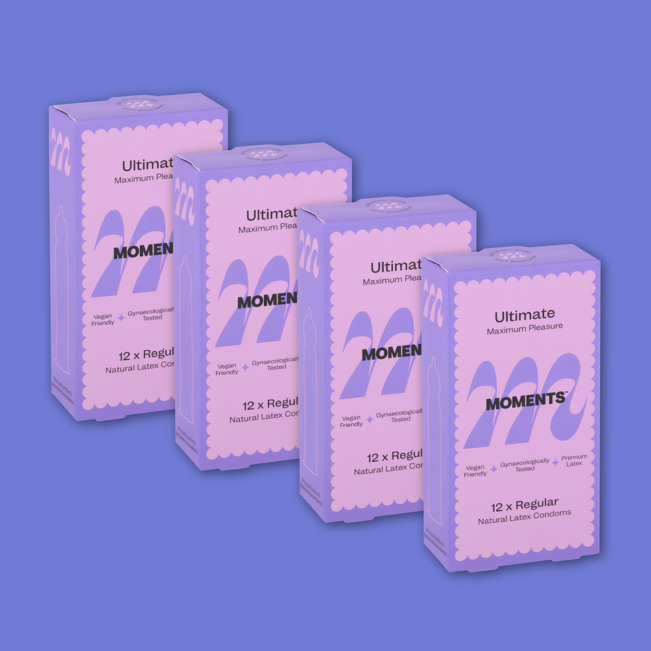 Close-up view of Moments Ultimate condom with its distinctive purple packaging