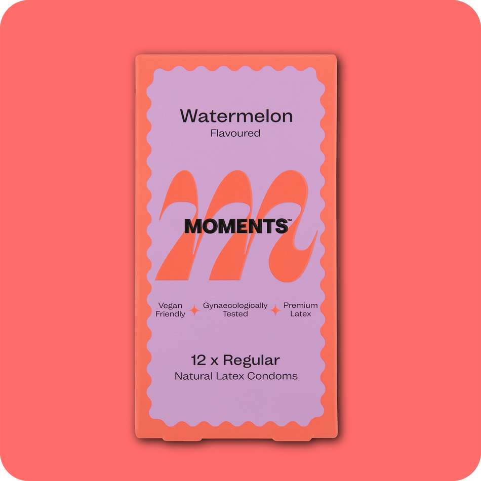Moments Watermelon flavoured condom displayed on a pink surface
